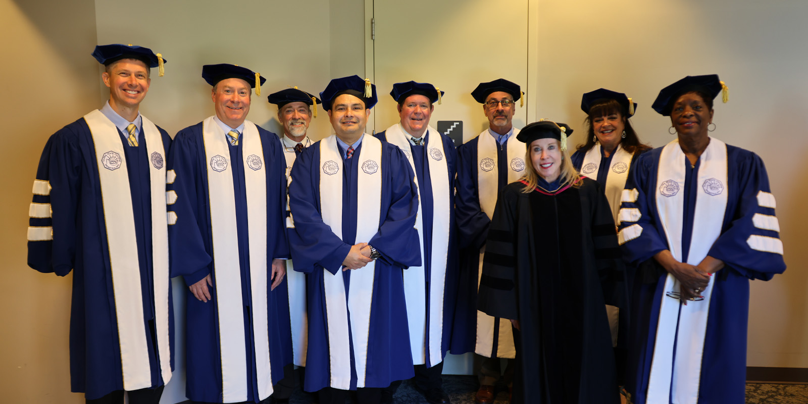 The Clark State Board of Trustees wearing graduation regalia.