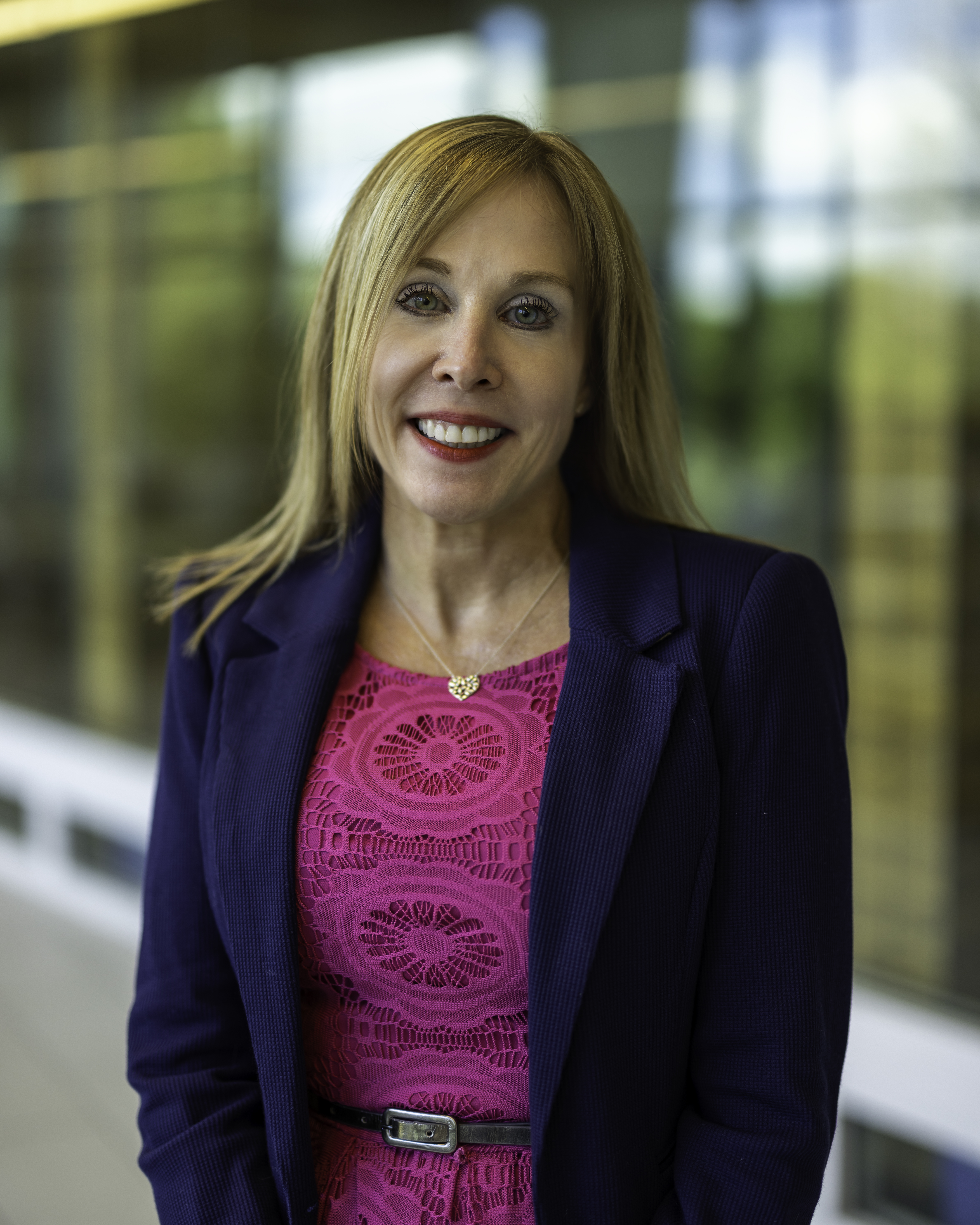 Head shot of Clark State College president Jo Alice Blondin, Ph.D., in a pink dress and blue blazer.