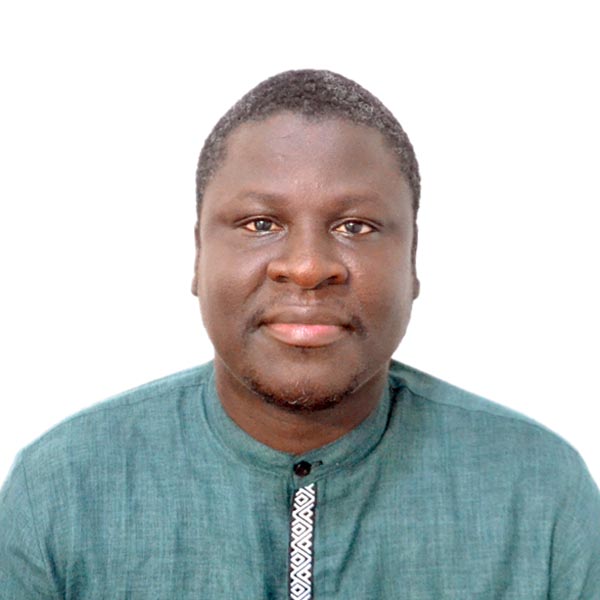 African American male wearing teal button down shirt.