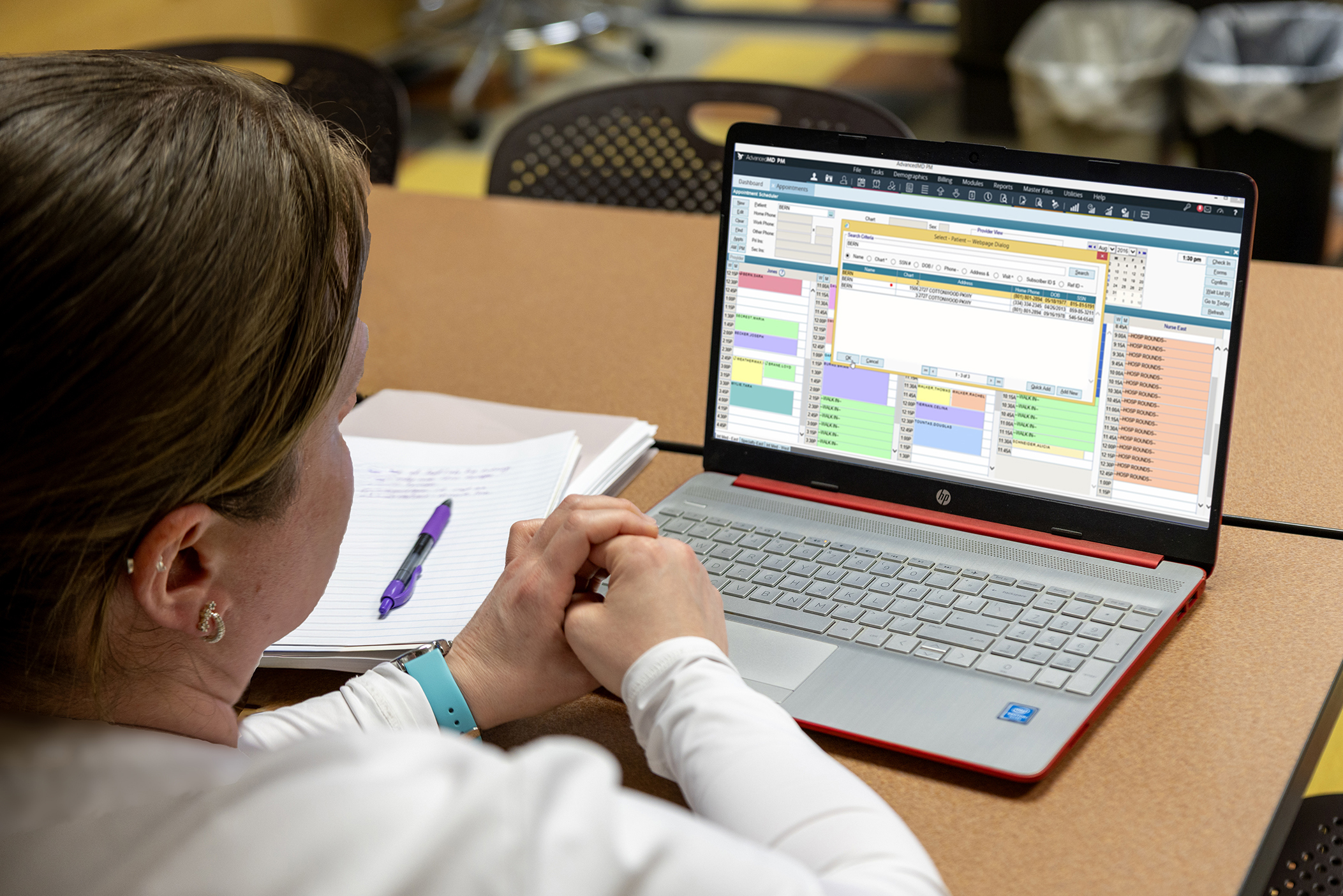 Student working on medical coding coursework on laptop