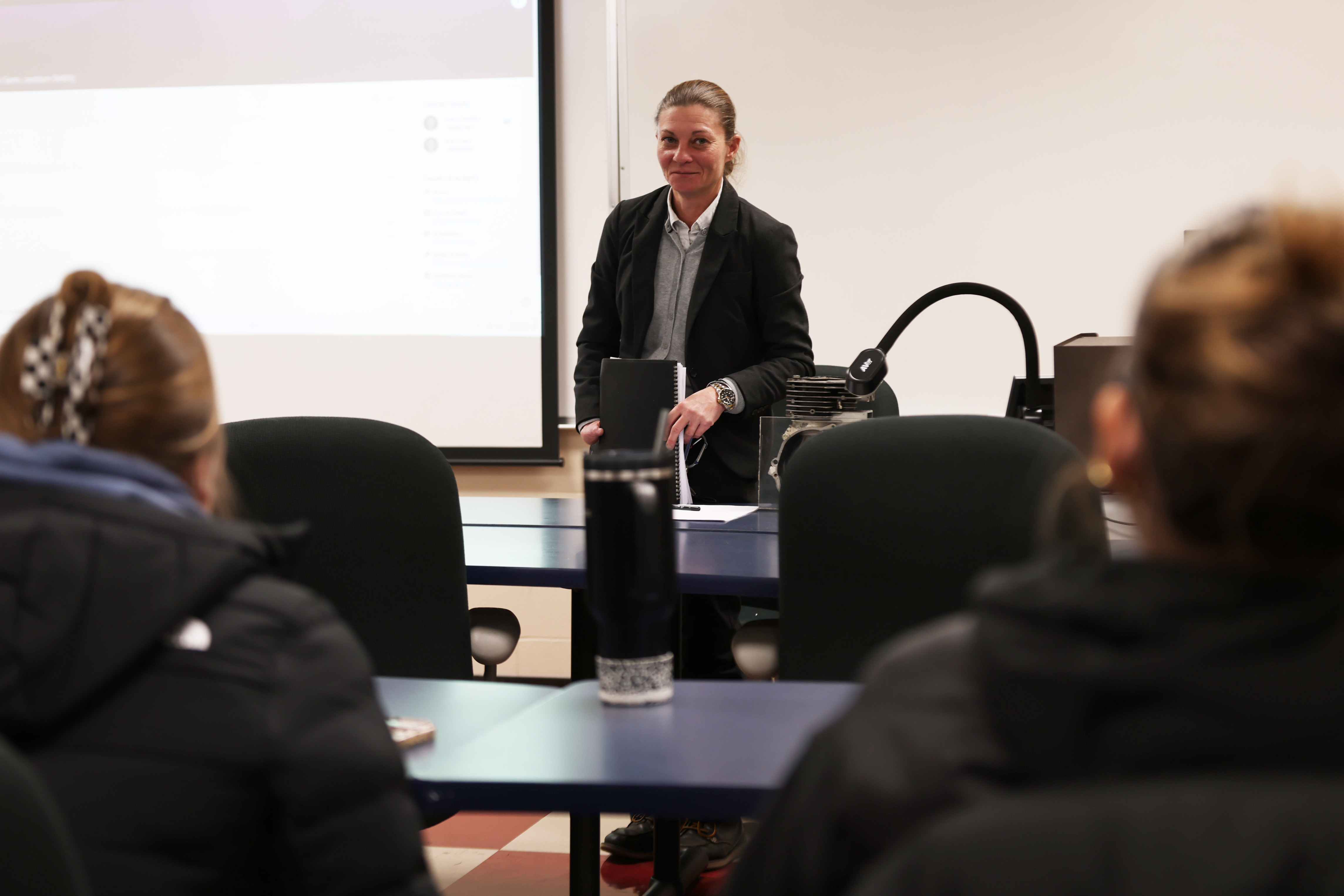 Student presenting business plan to classroom.