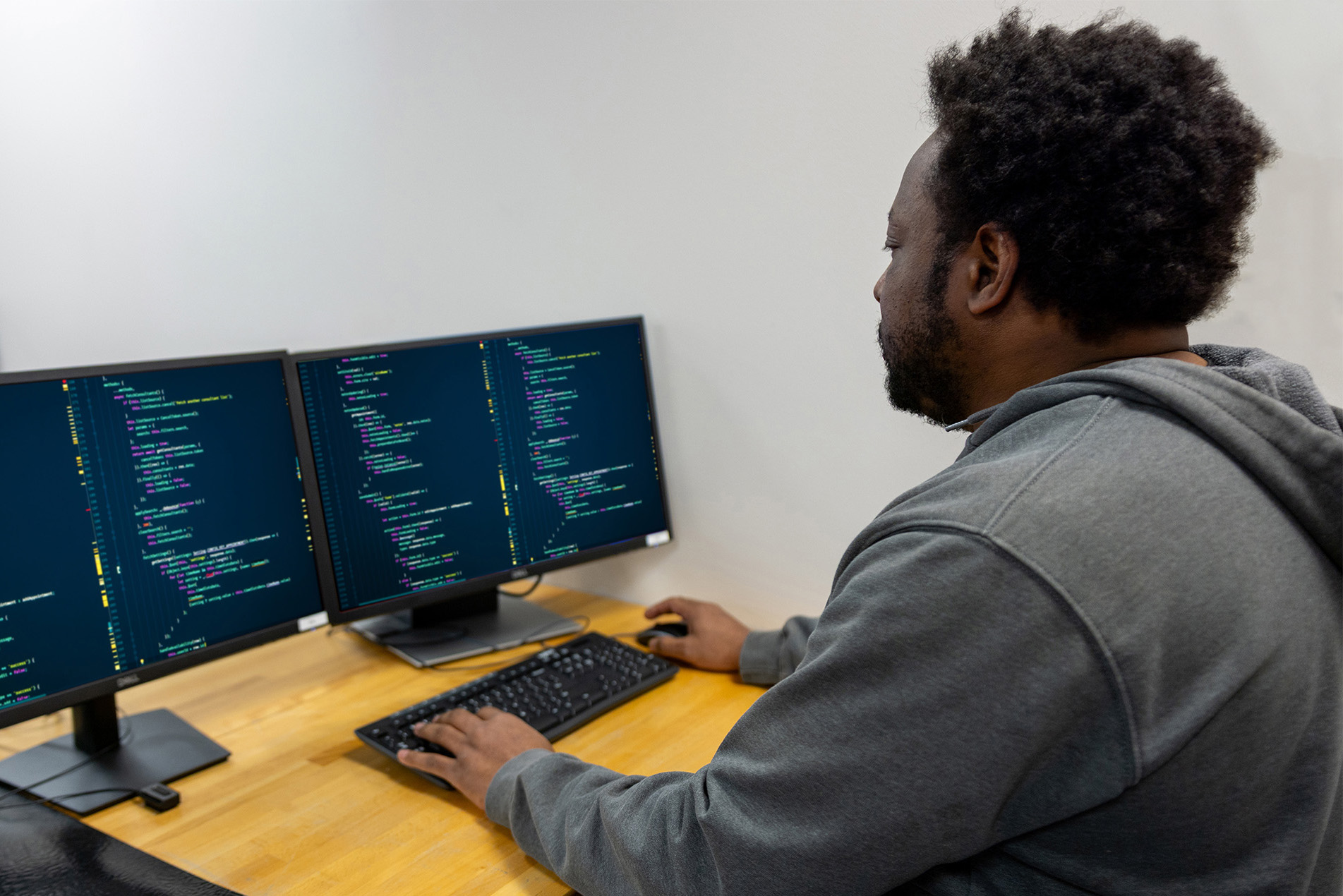 student working on coding on computer