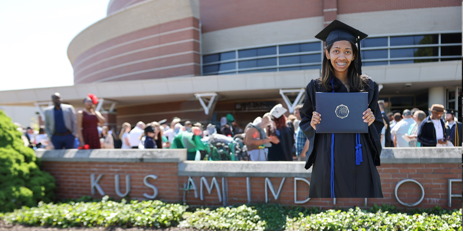 CCP student holding diploma at graduation