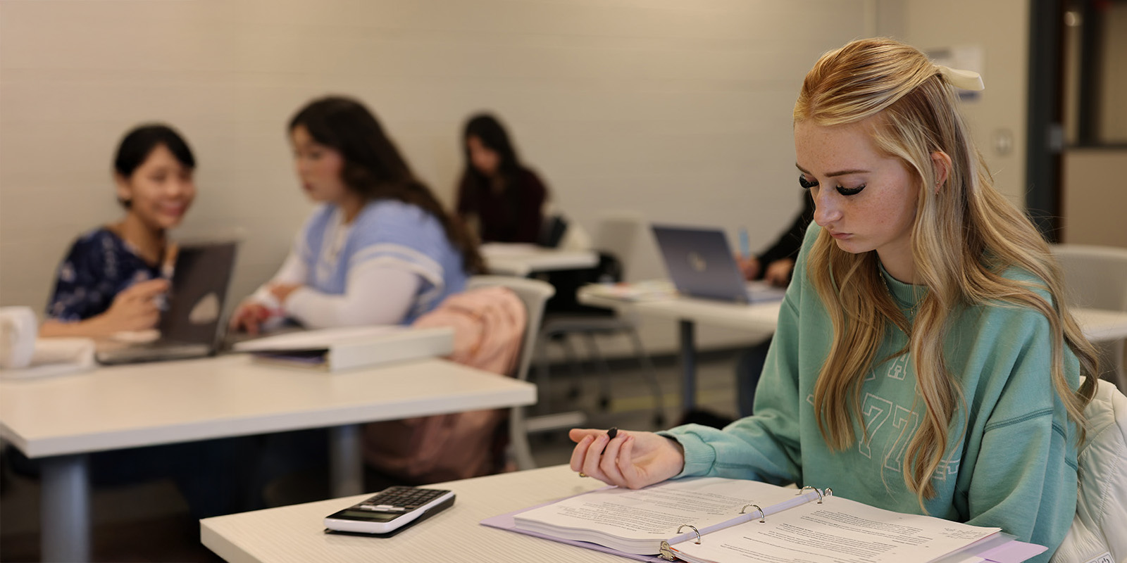 Student in class working on handout