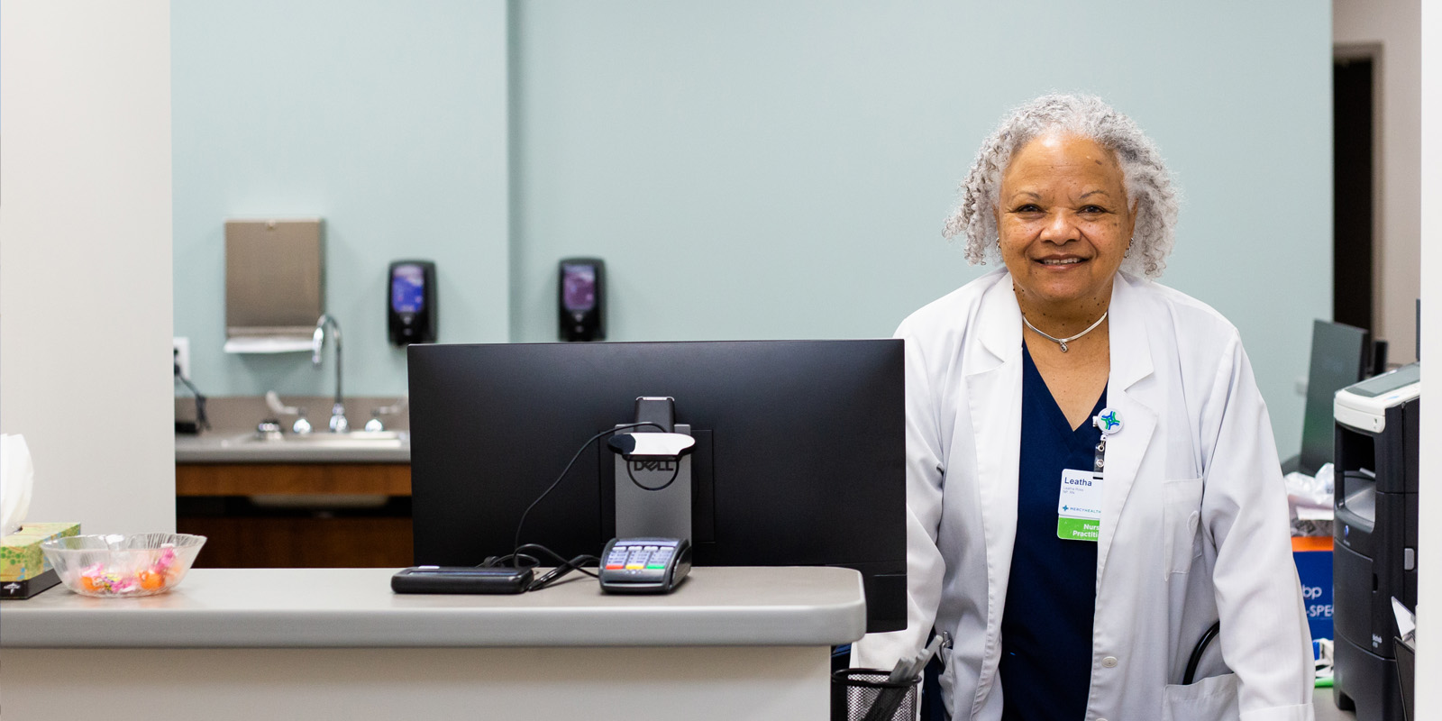 Mercy Health team member at welcome desk