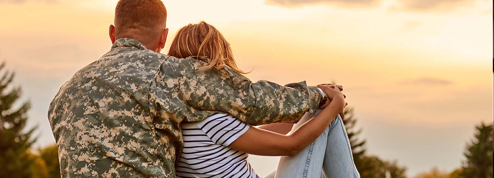 military couple sitting together