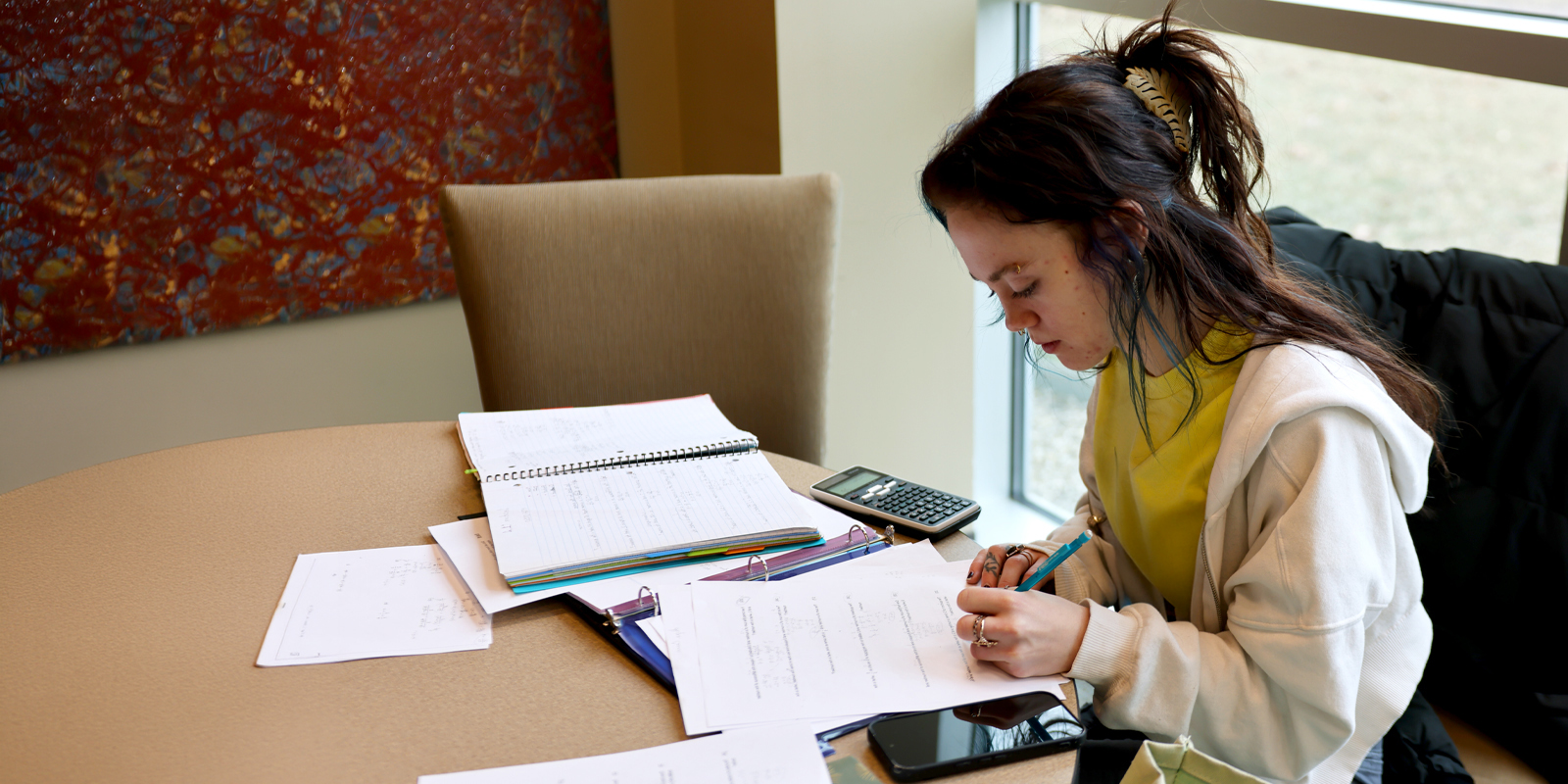 Student working on handout at table