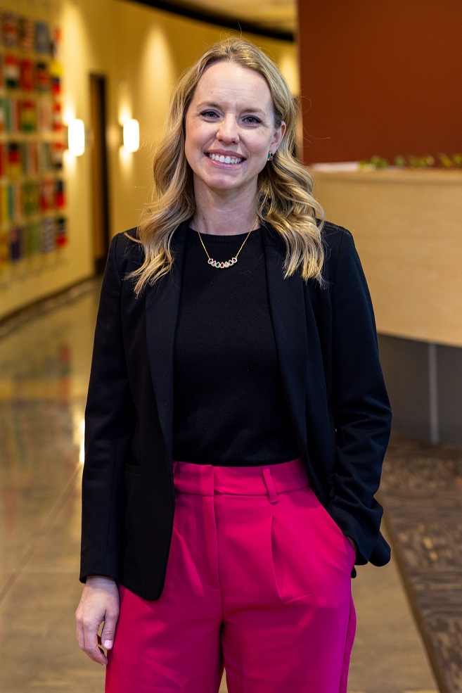 Heather Biddle student with blonde hair, black jacket and pink pants on Clark State campus